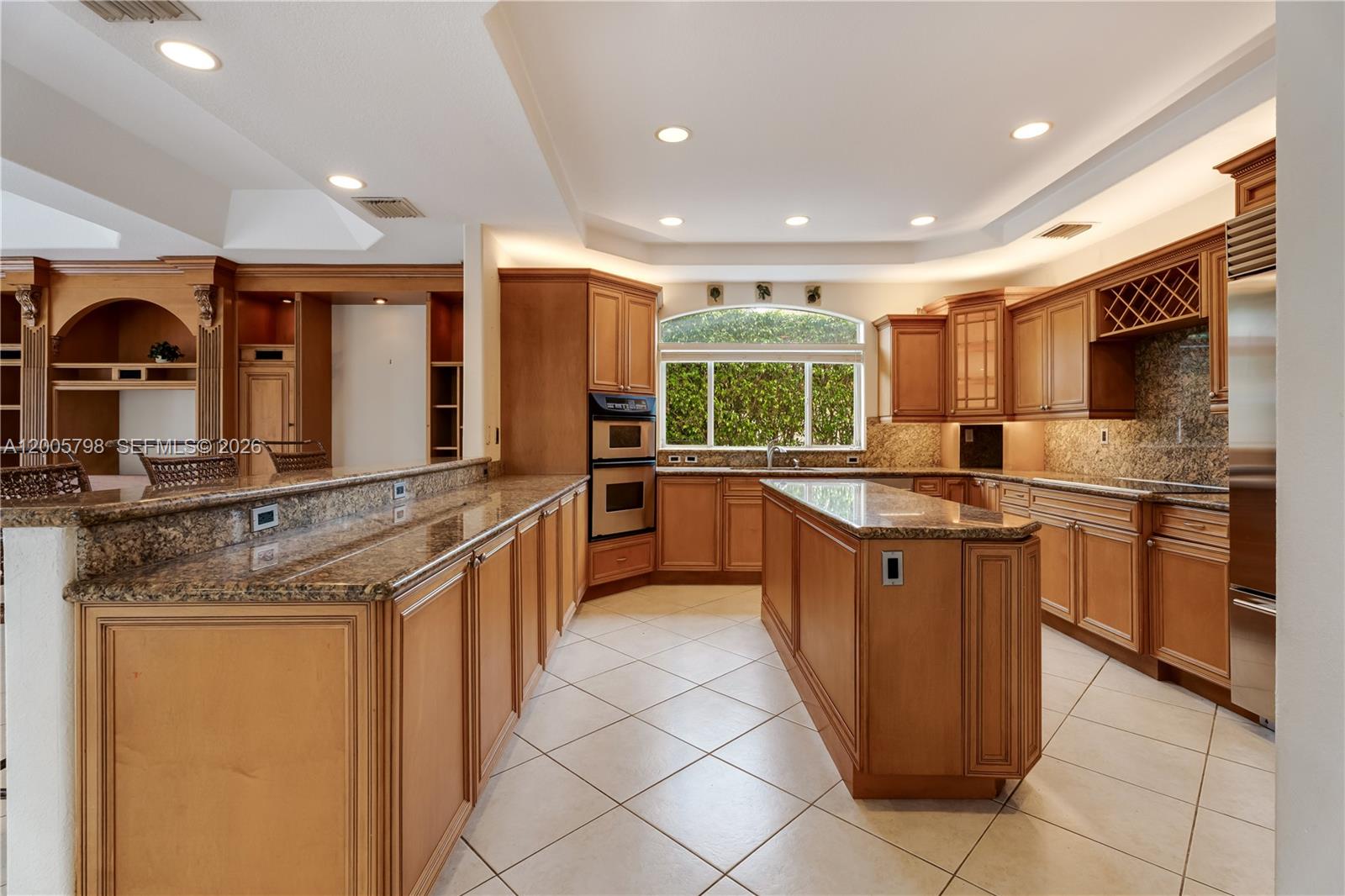 11071 Southwest 28th Street Miami, FL 33165 - Photo 12 of 78 a large kitchen with stainless steel appliances granite countertop a large counter top and a stove