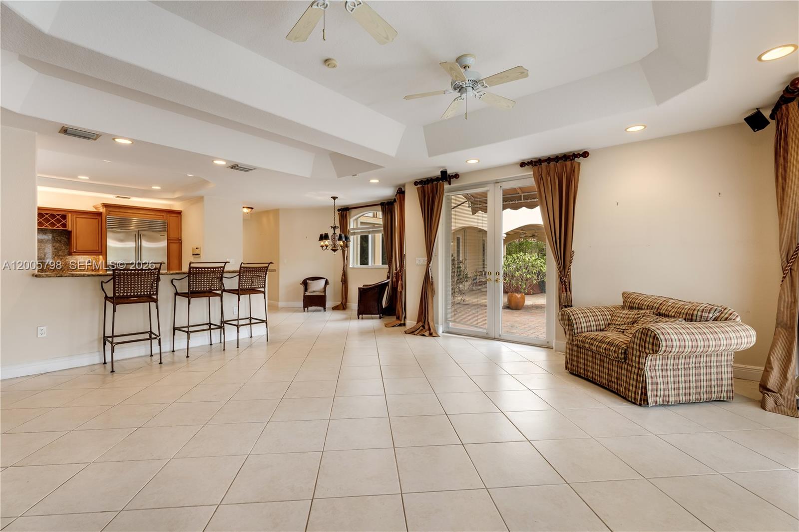 11071 Southwest 28th Street Miami, FL 33165 - Photo 22 of 78 a view of livingroom with furniture and a ceiling fan
