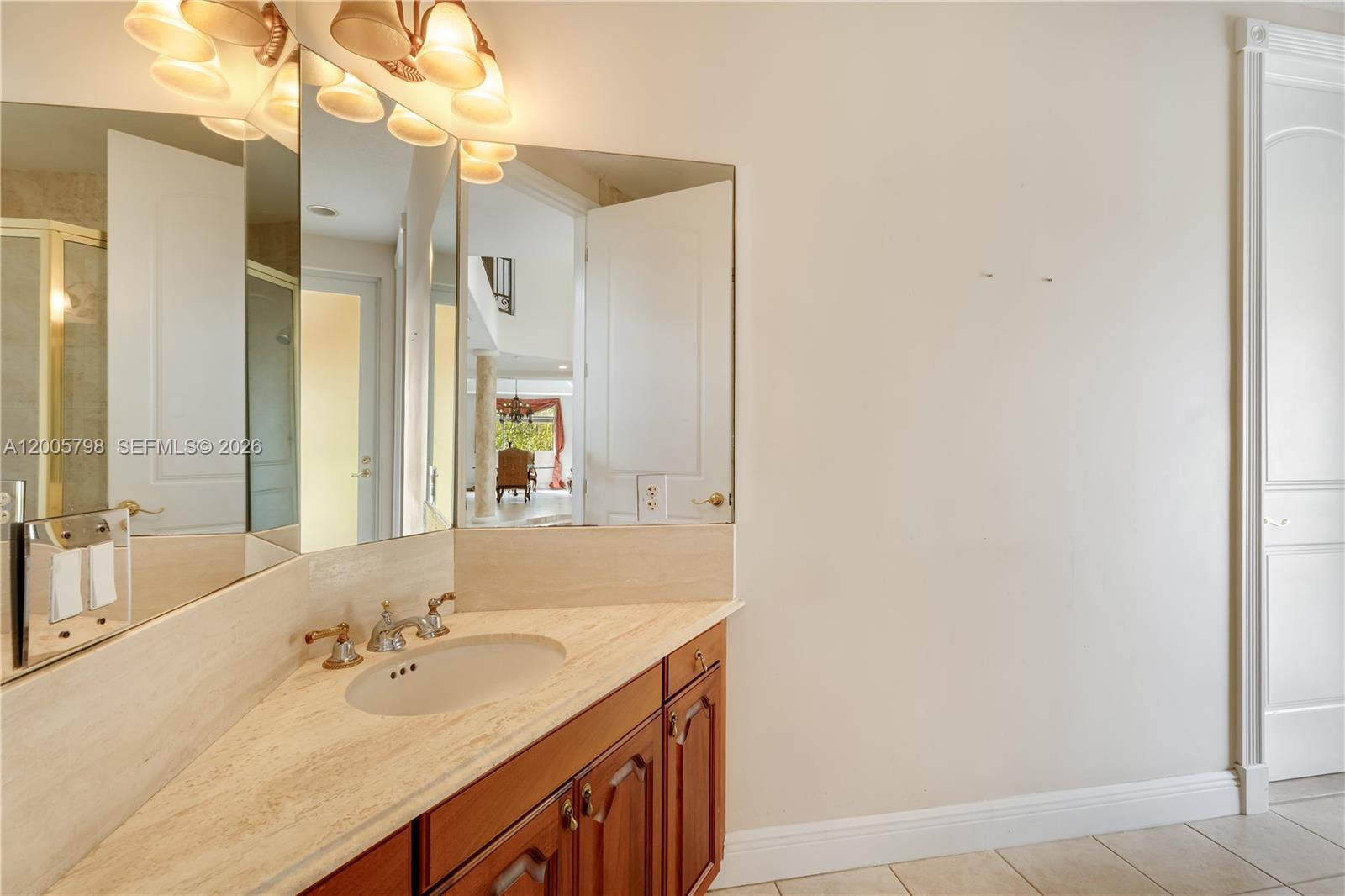 11071 Southwest 28th Street Miami, FL 33165 - Photo 23 of 78 a bathroom with a sink and a mirror