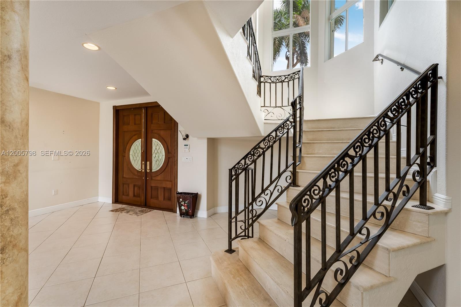 11071 Southwest 28th Street Miami, FL 33165 - Photo 24 of 78 a view of entryway with wooden floor and stairs