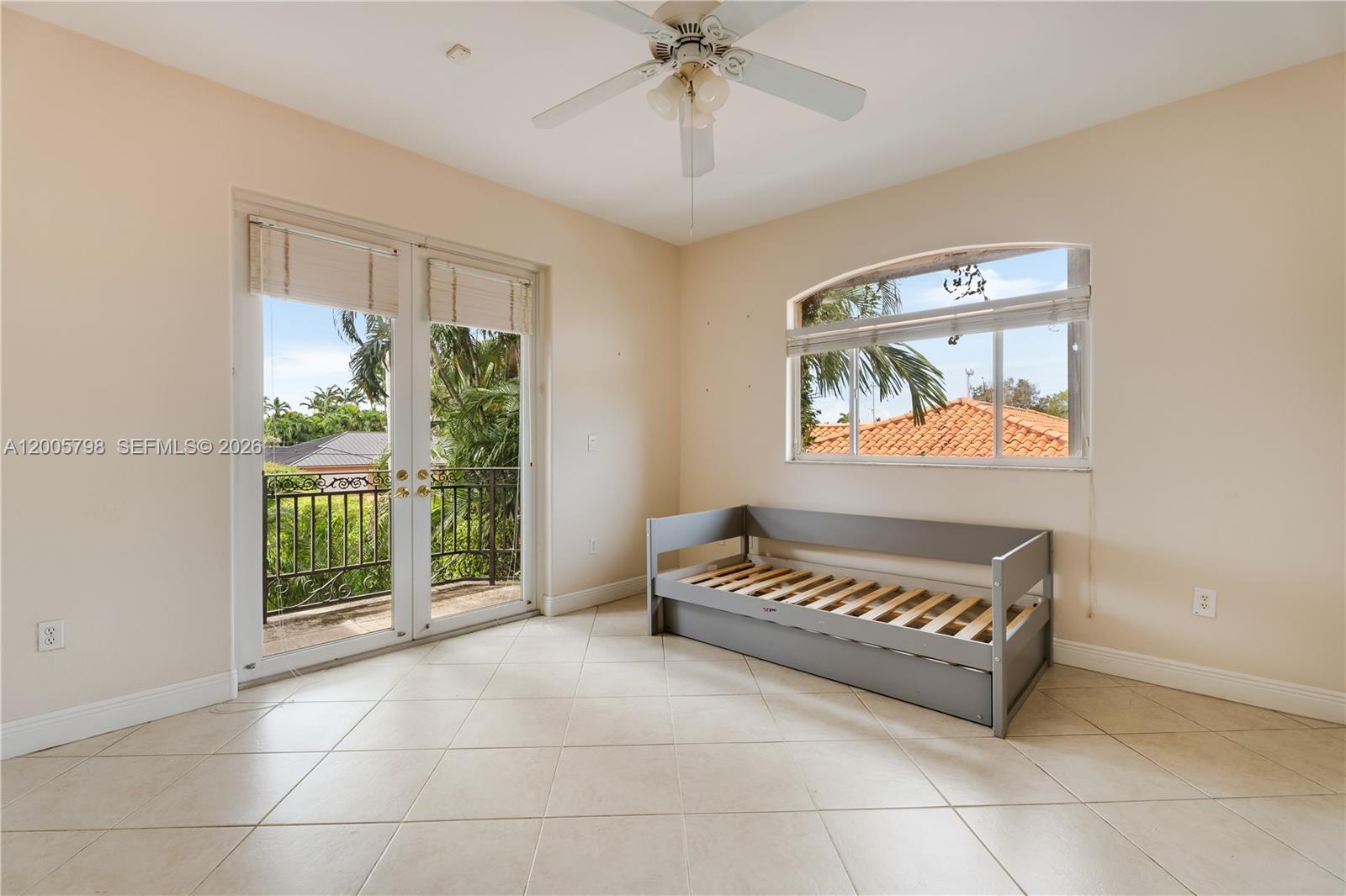 11071 Southwest 28th Street Miami, FL 33165 - Photo 25 of 78 a living room with a baby crib furniture and a window