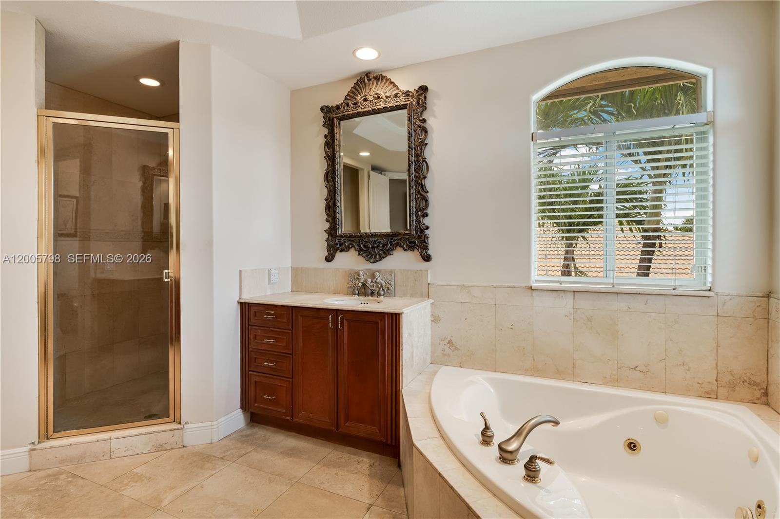 11071 Southwest 28th Street Miami, FL 33165 - Photo 38 of 78 a bathroom with a tub a sink and a large mirror