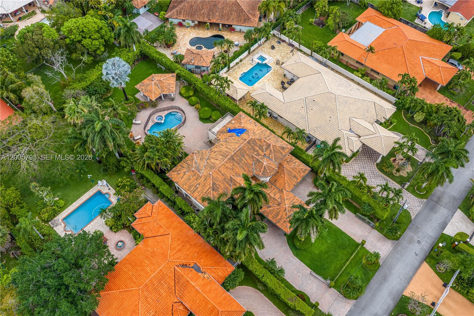 11071 Southwest 28th Street Miami, FL 33165 - Photo 70 of 78 an aerial view of a house with swimming pool and large trees