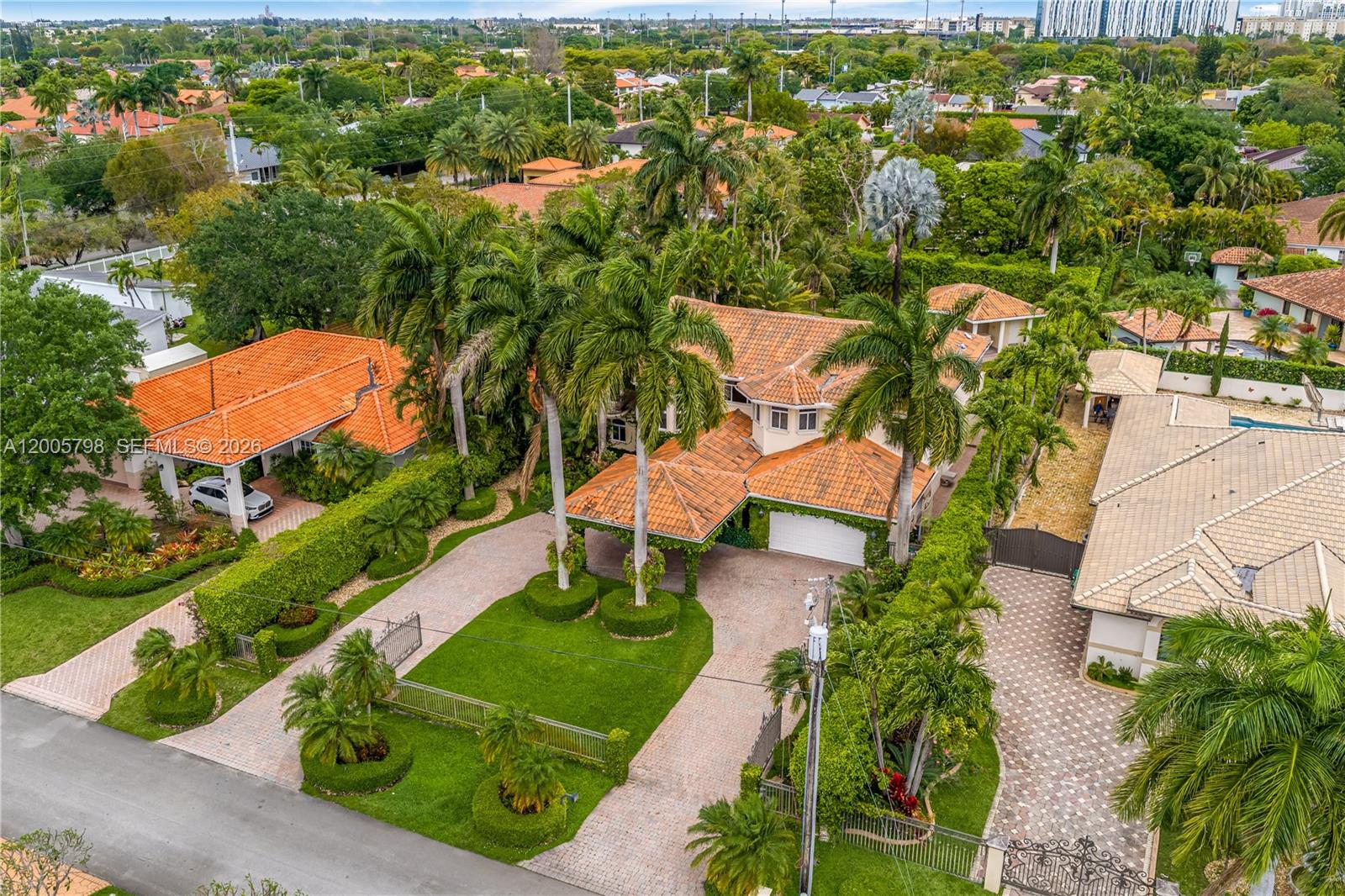 11071 Southwest 28th Street Miami, FL 33165 - Photo 73 of 78 an aerial view of a house with a yard and lake view