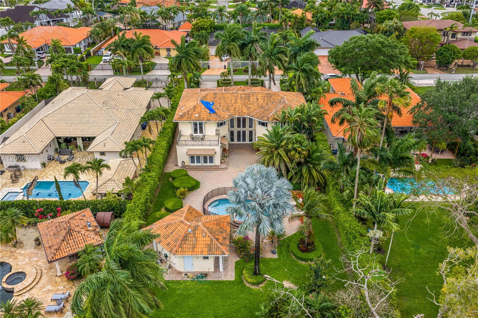 11071 Southwest 28th Street Miami, FL 33165 - Photo 76 of 78 an aerial view of a house with a yard and lake view
