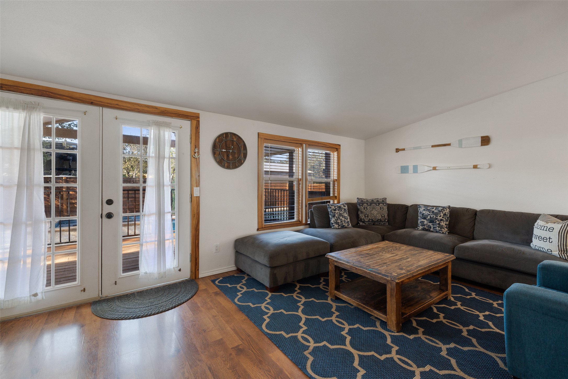 5519 Hiline Road Austin, TX 78734 - Photo 16 of 40 Living room with vaulted ceiling, french doors, and wood finished floors