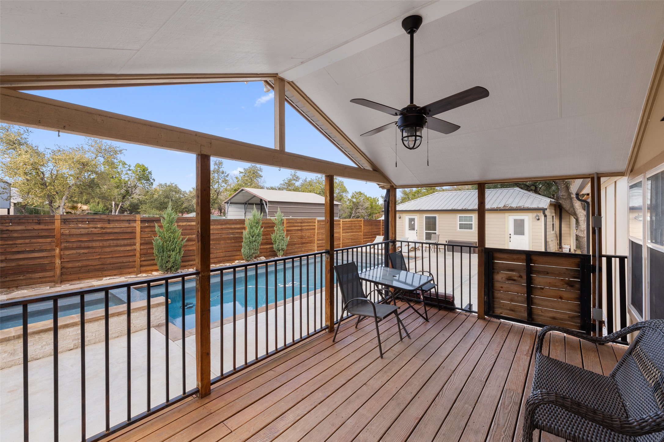 5519 Hiline Road Austin, TX 78734 - Photo 24 of 40 Deck featuring a fenced backyard, a ceiling fan, and a fenced in pool