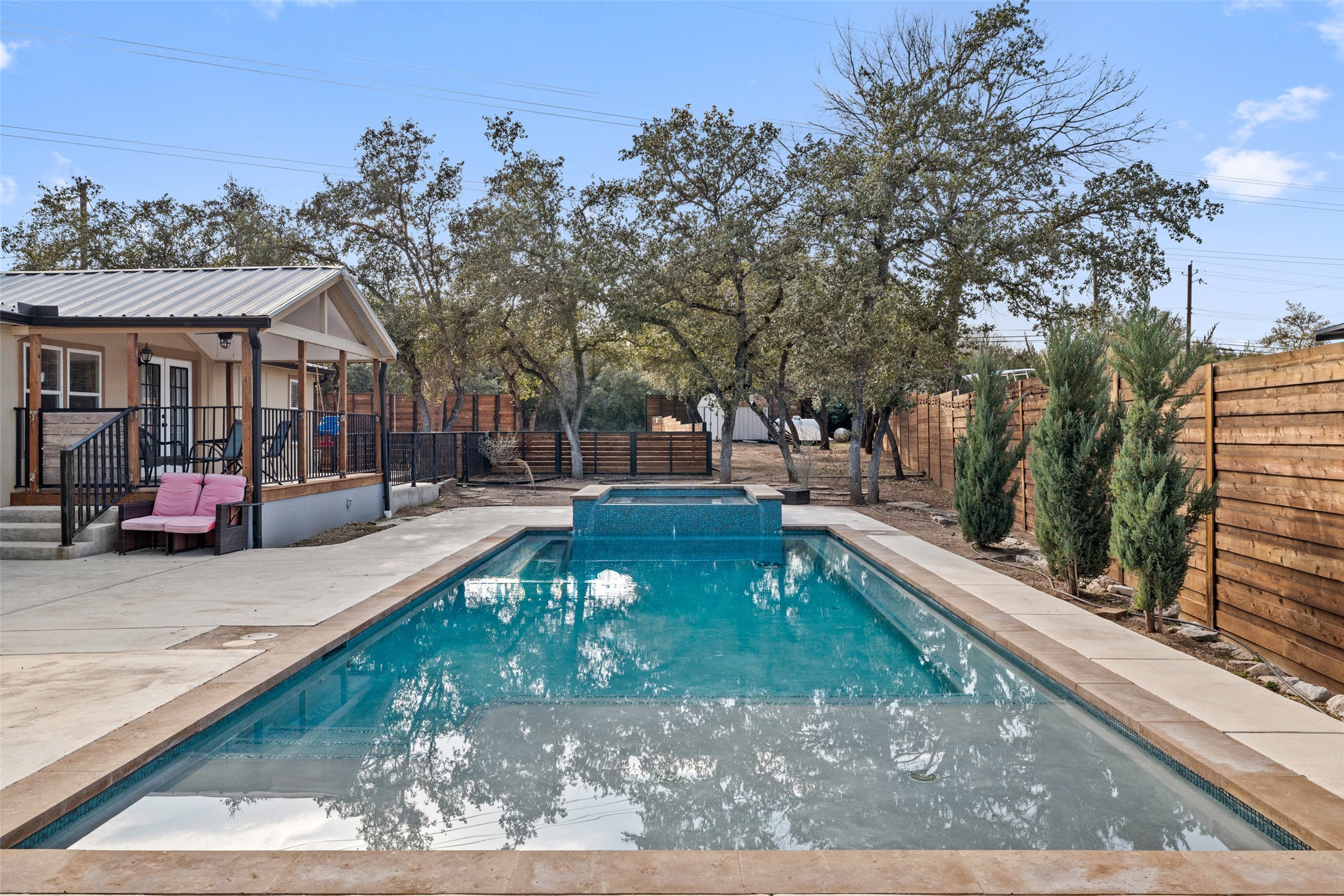 5519 Hiline Road Austin, TX 78734 - Photo 39 of 40 View of pool with a patio area, a fenced backyard, and a pool with connected hot tub