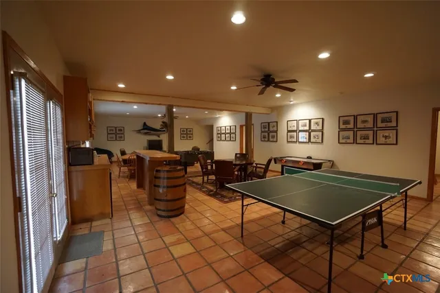 a kitchen with a table and chairs