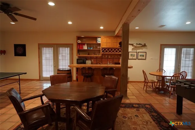 a dining room with furniture and window