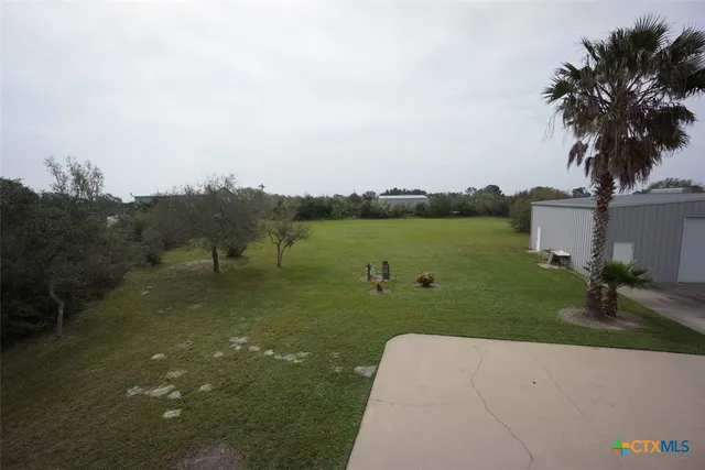 a view of a lake and a yard