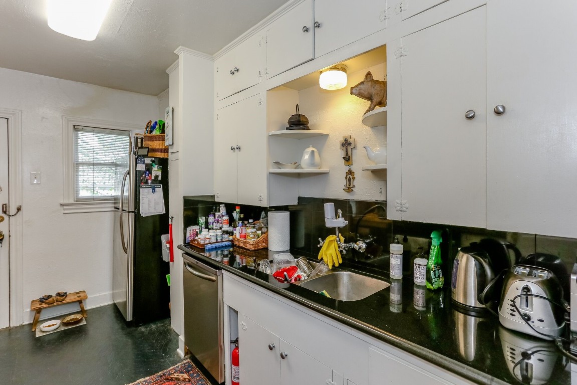 1740 Banks Street, Unit 2 Houston, TX 77098 - Photo 7 of 22 a kitchen with stainless steel appliances granite countertop a sink and cabinets