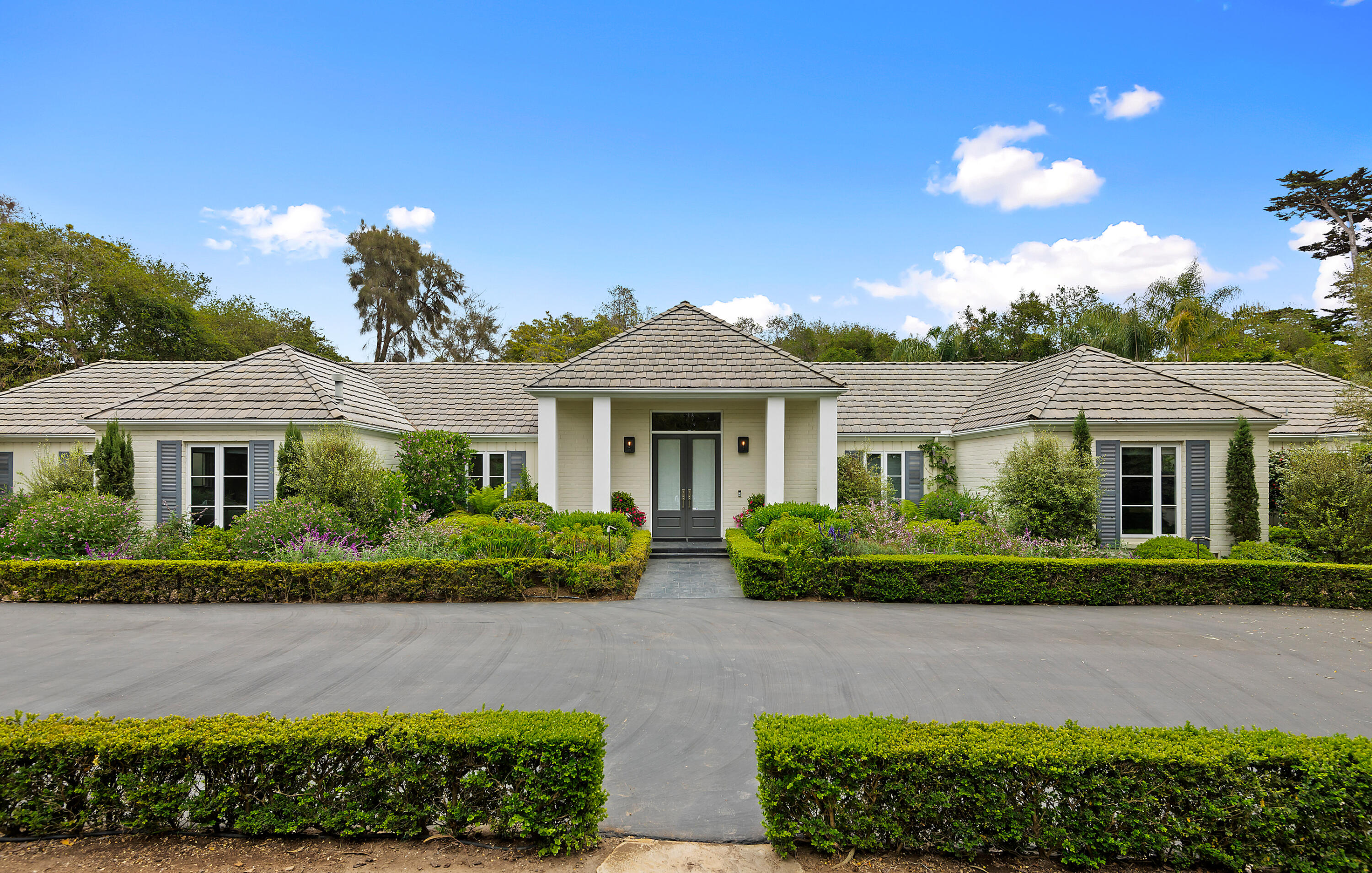 1 Middle Road Montecito, CA 93108 - Photo 2 of 30 a front view of a house with a yard
