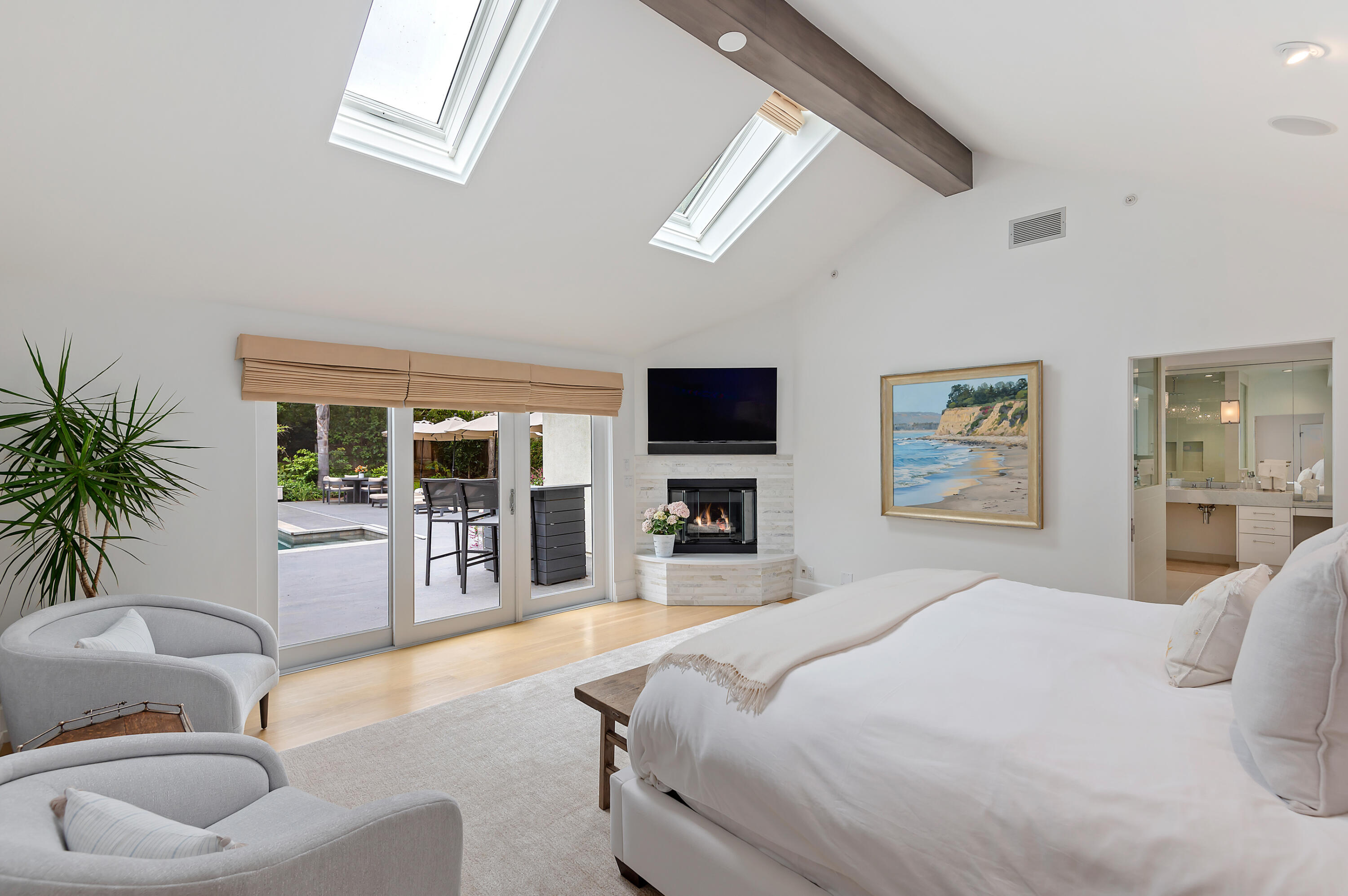 1 Middle Road Montecito, CA 93108 - Photo 8 of 30 a bedroom with a large bed a flat screen tv and couches