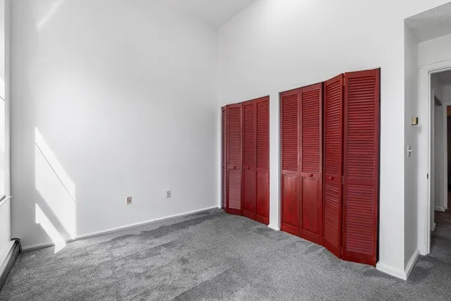 an empty room with a wooden door