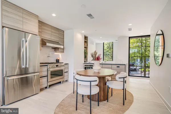 a kitchen with refrigerator cabinets and furniture