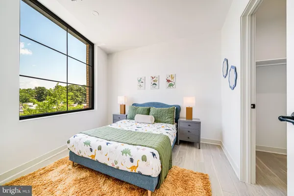 a bedroom with a bed and window
