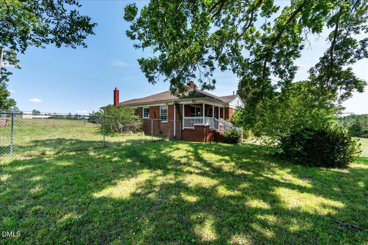 109 Little Ponderosa Road Macon, NC 27551 - Photo 27 of 32 a view of a house with a yard