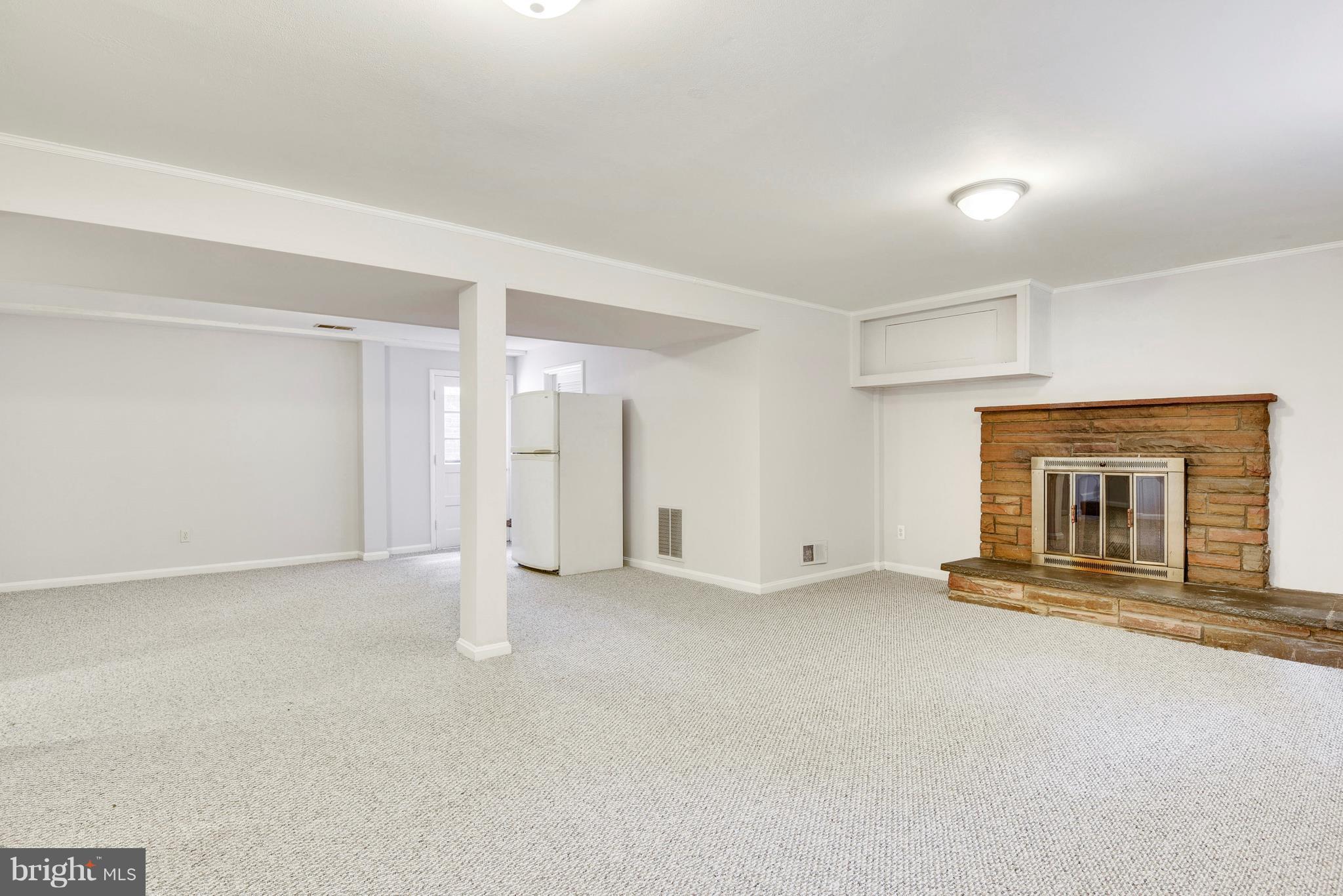 9005 Bradford Road Silver Spring, MD 20901 - Photo 18 of 28 a view of empty room with a fireplace