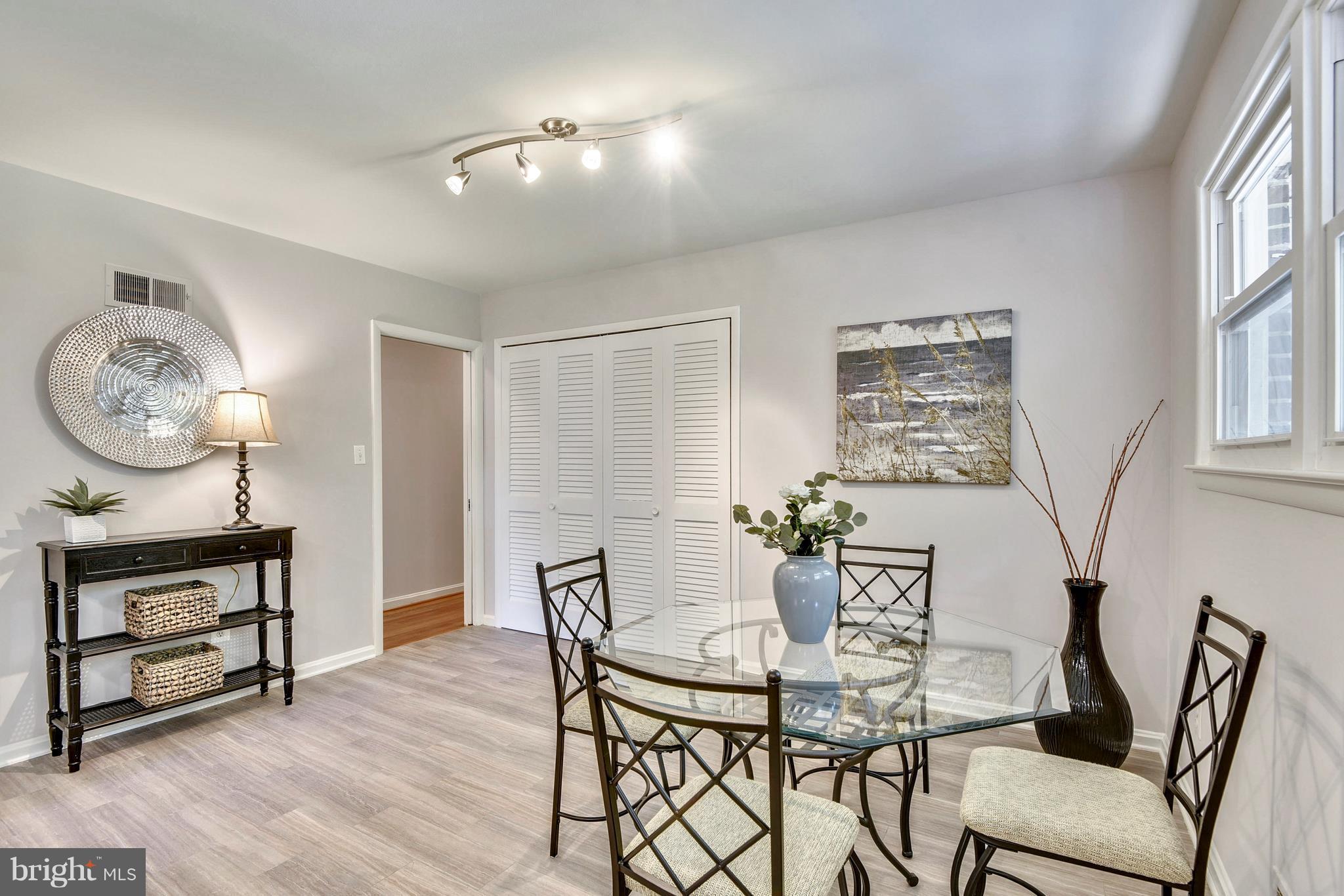 9005 Bradford Road Silver Spring, MD 20901 - Photo 10 of 28 a view of a dining room with furniture and a chandelier
