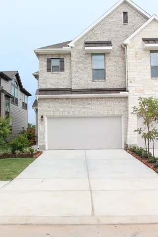 a front view of a house with yard