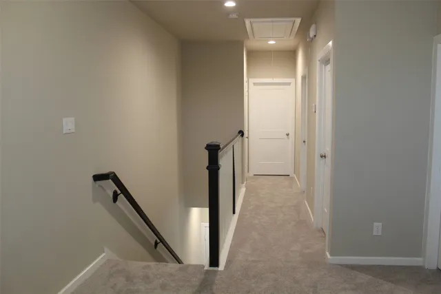 a view of a hallway with staircase