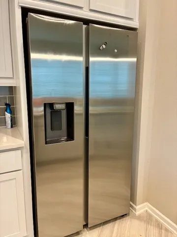 a bathroom with a shower and a door