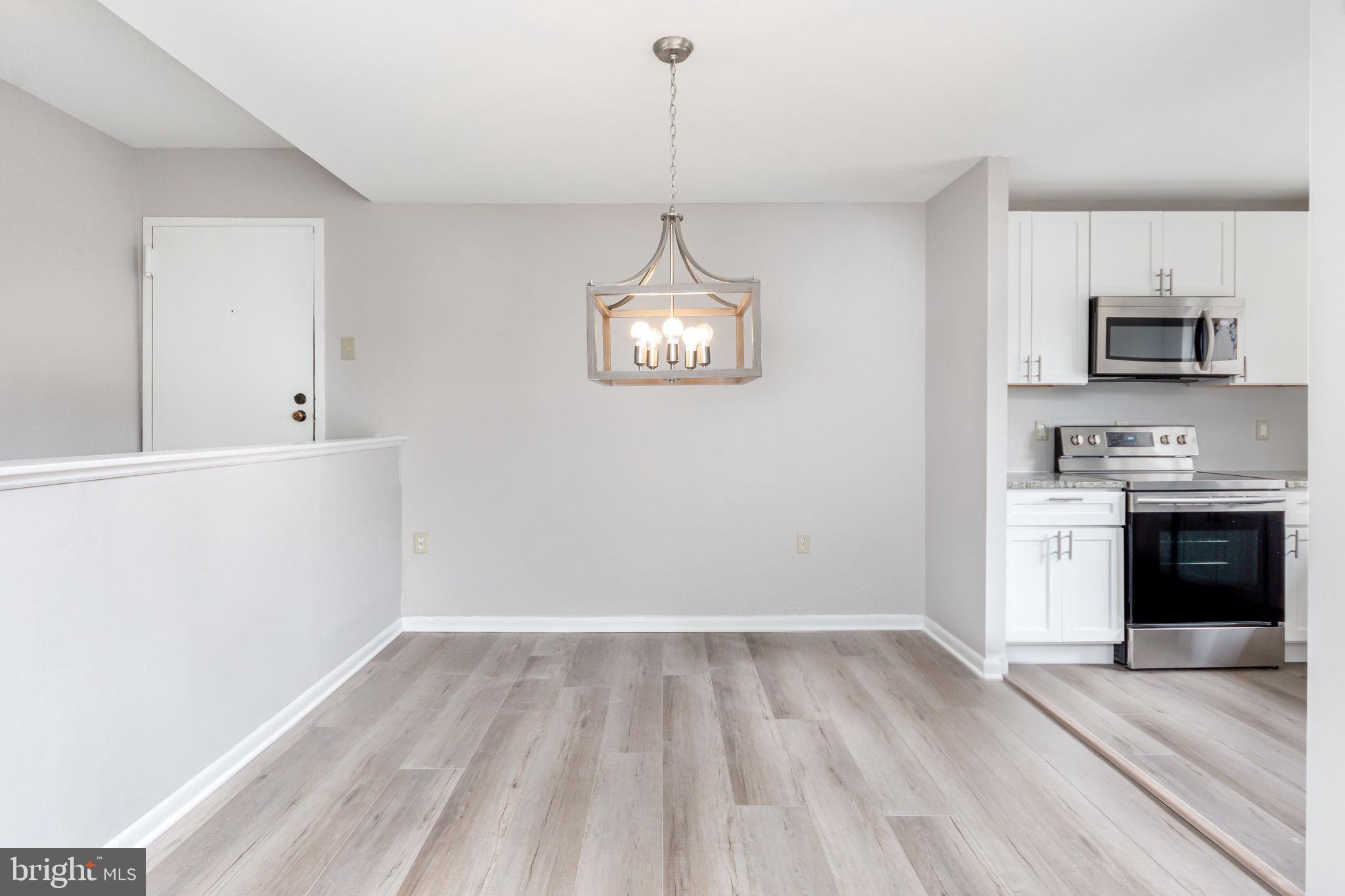 15710 Dorset Road, Unit 103 Laurel, MD 20707 - Photo 5 of 14 Dining room with new lighting
