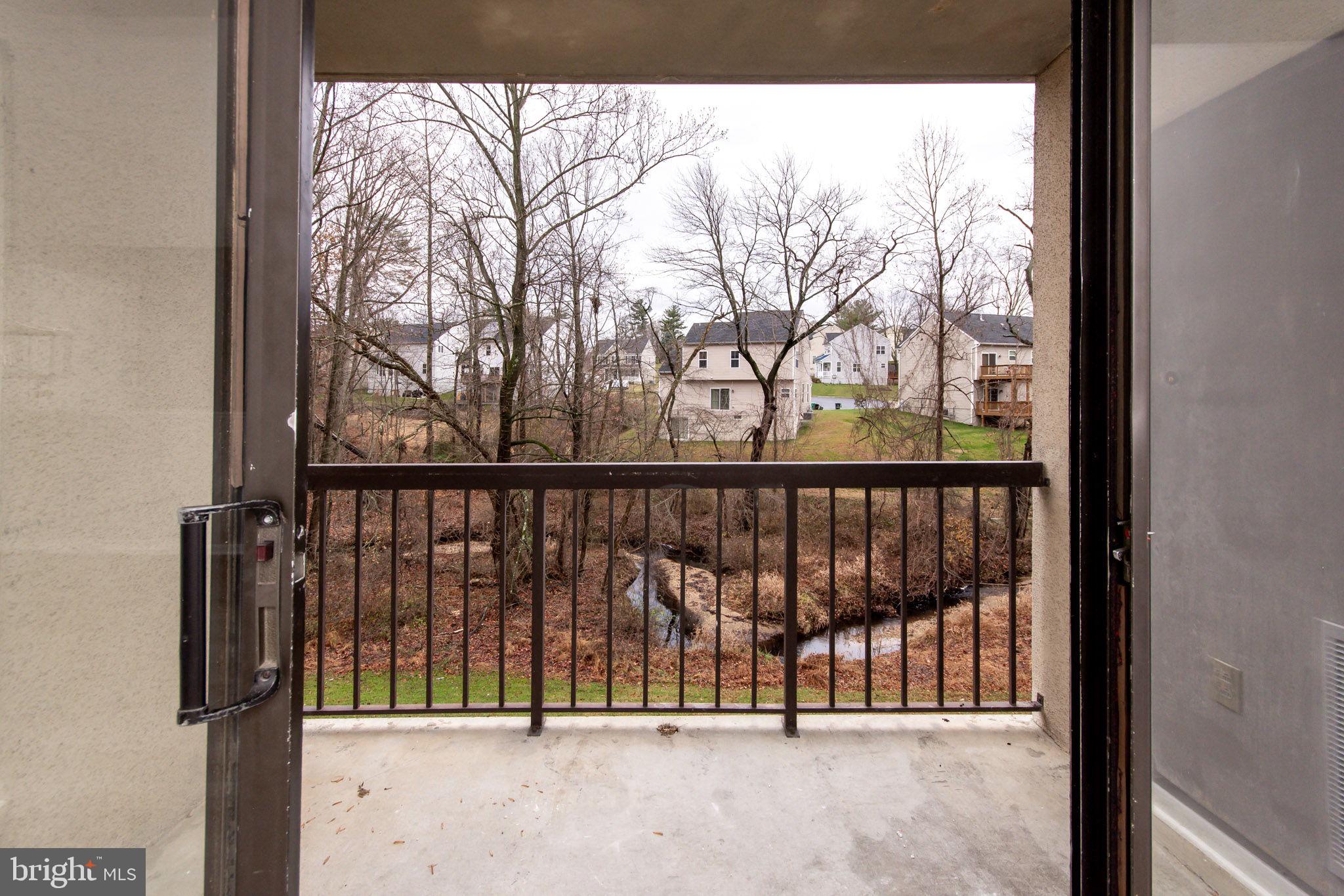 15710 Dorset Road, Unit 103 Laurel, MD 20707 - Photo 8 of 14 Sliders to balcony overlooking small creek.