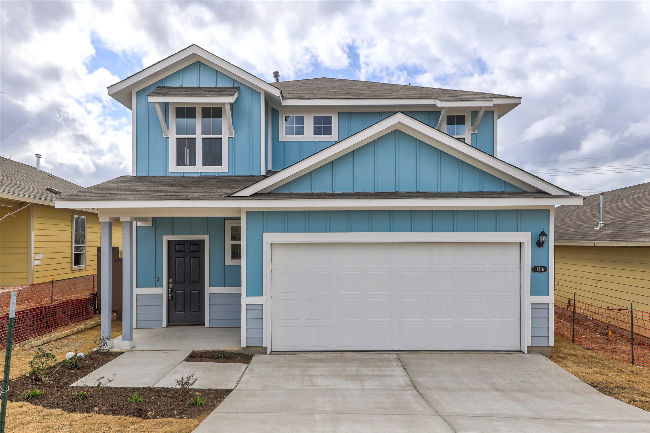 a front view of a house with a yard