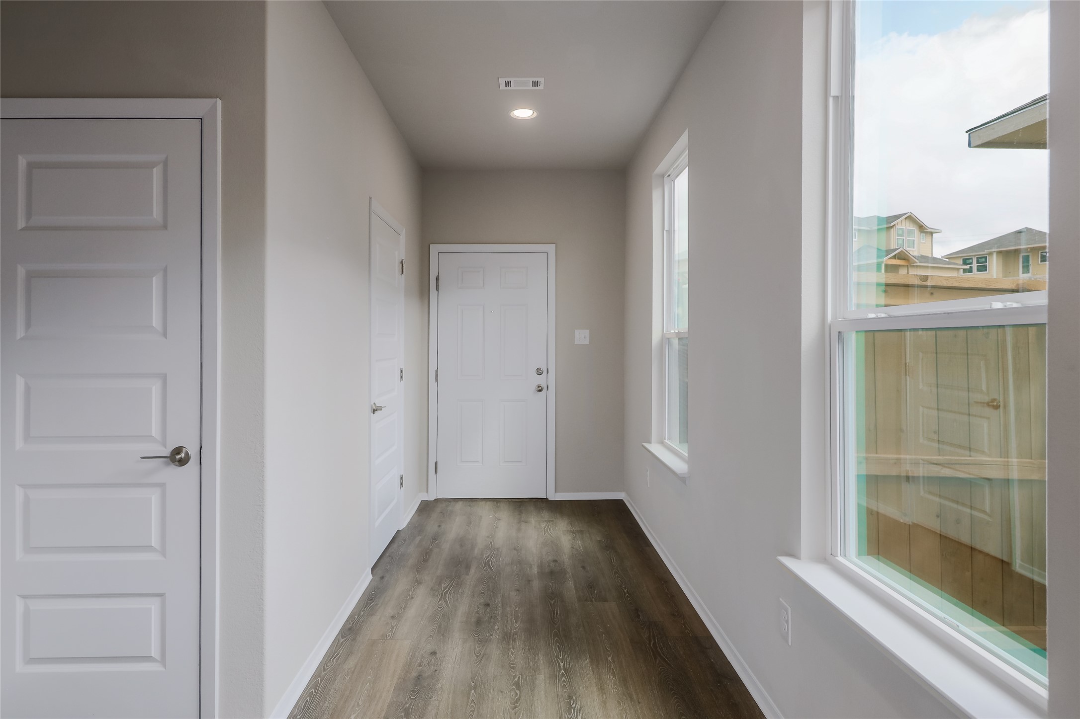 11416 Milano Drive Austin, TX 78747 - Photo 11 of 25 Entryway with wood finished floors and recessed lighting