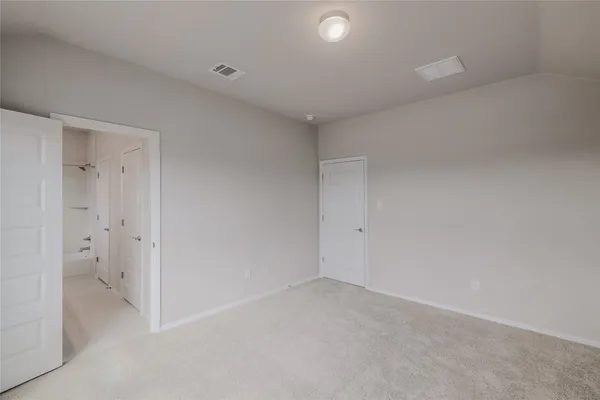 a view of hallway with wooden floor