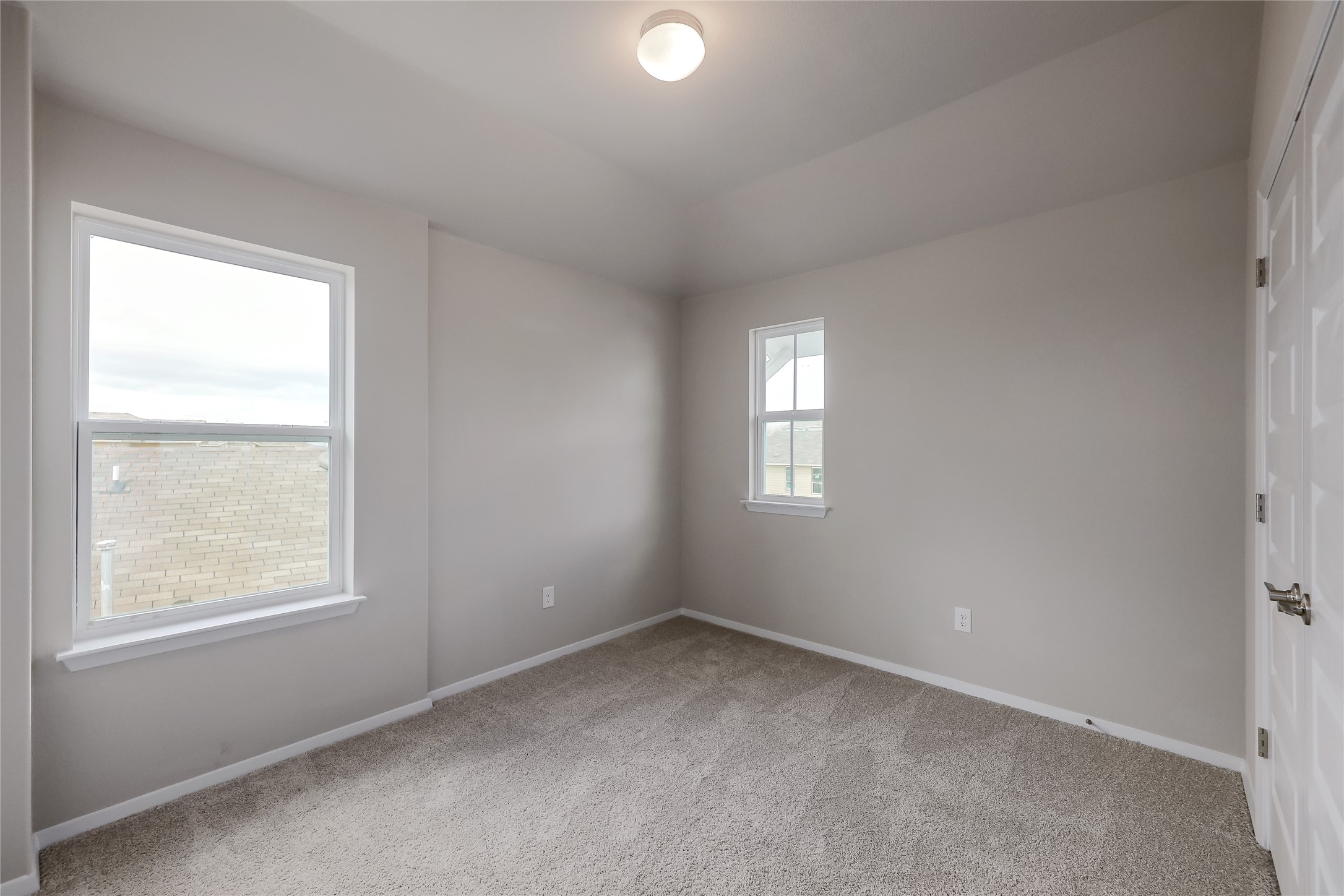 11416 Milano Drive Austin, TX 78747 - Photo 17 of 25 Unfurnished room with light colored carpet and baseboards