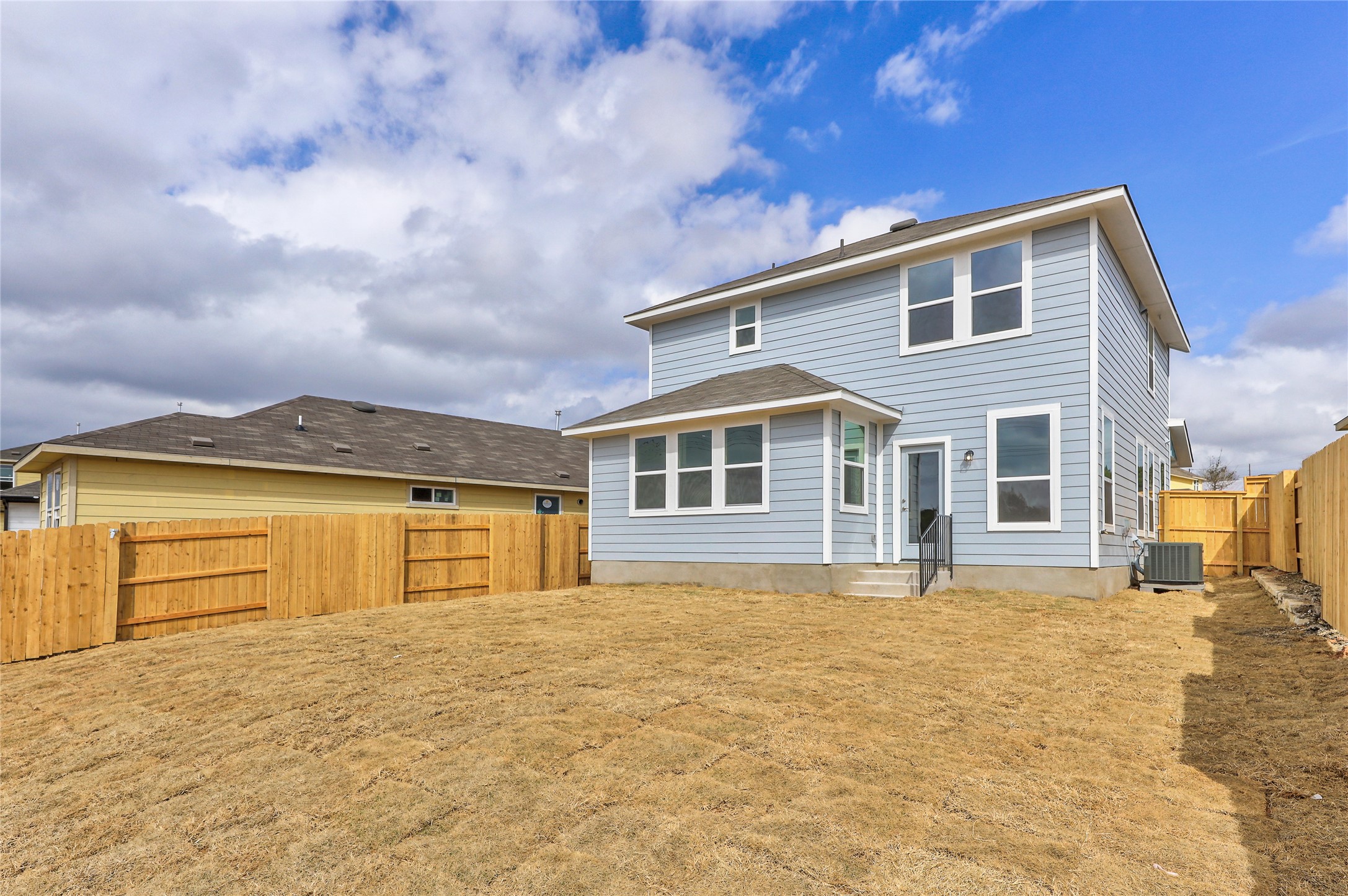 11416 Milano Drive Austin, TX 78747 - Photo 22 of 25 Back of property with a fenced backyard