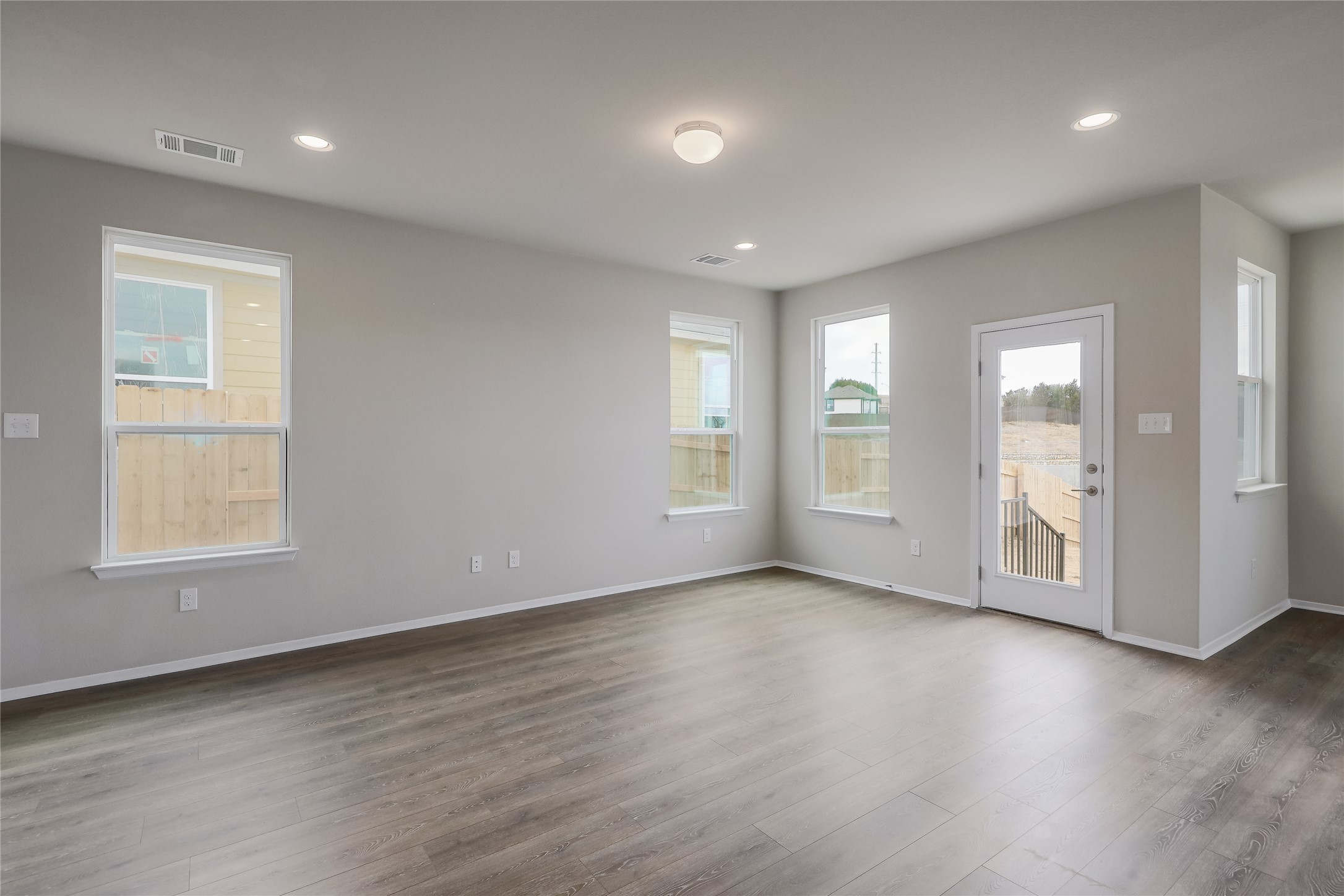 11416 Milano Drive Austin, TX 78747 - Photo 5 of 25 Spare room featuring wood finished floors and recessed lighting