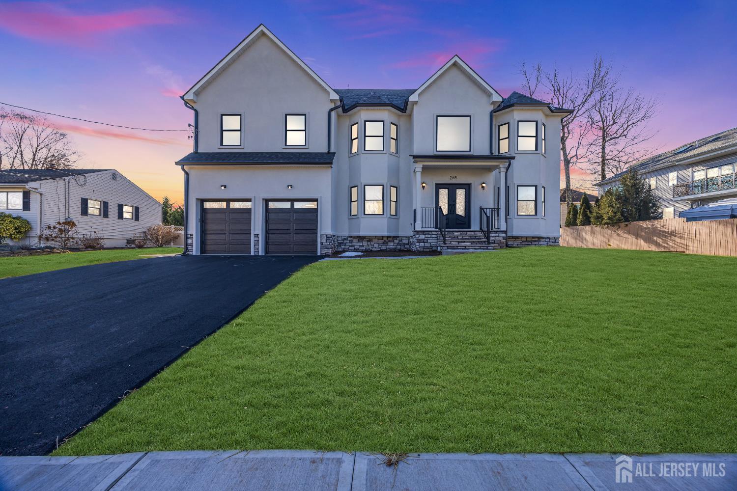 265 West Prescott Avenue Edison, NJ 08820 - Photo 1 of 56 a front view of a house with a yard