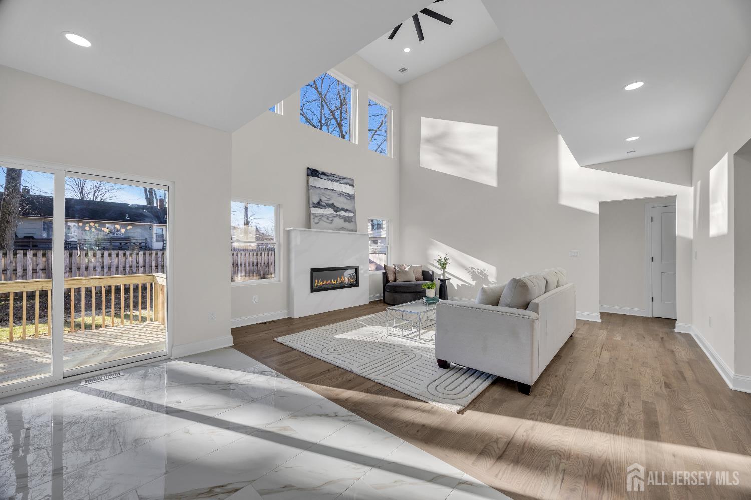 265 West Prescott Avenue Edison, NJ 08820 - Photo 11 of 56 a living room with furniture and a fireplace