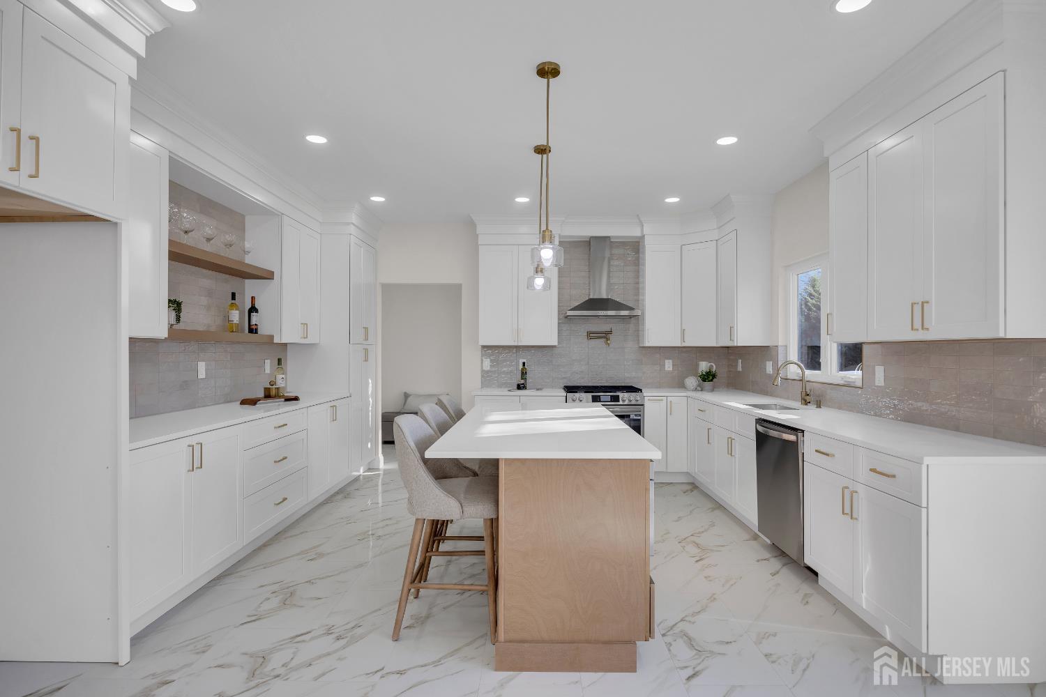 265 West Prescott Avenue Edison, NJ 08820 - Photo 16 of 56 a large kitchen with kitchen island a sink a center island stainless steel appliances and a center island