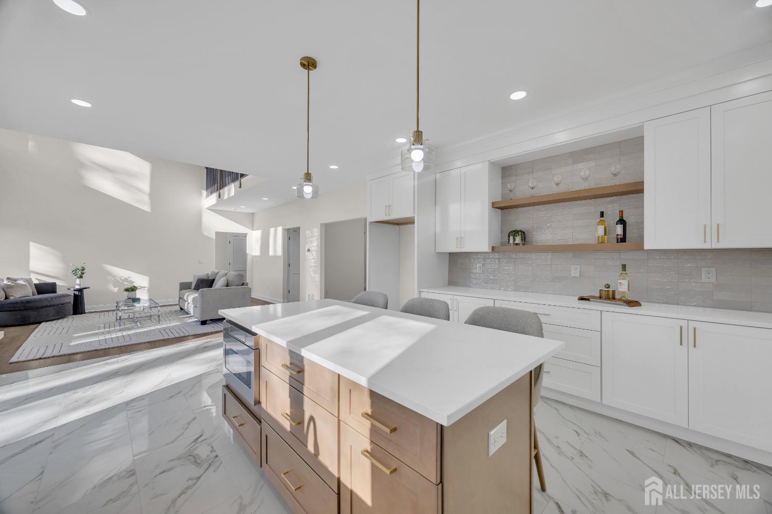 265 West Prescott Avenue Edison, NJ 08820 - Photo 20 of 56 a large kitchen with kitchen island a sink a stove a center island a stove and a cabinets