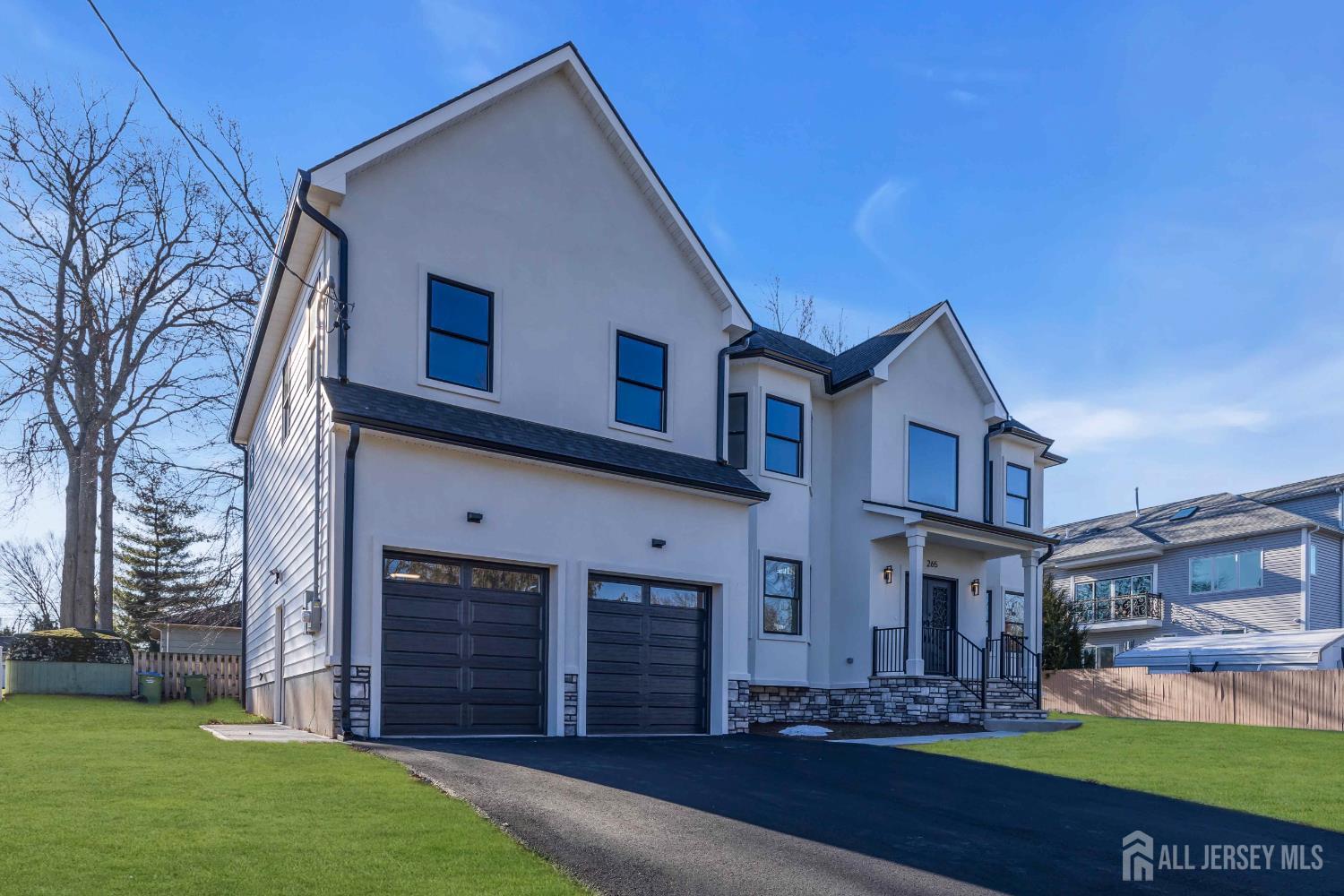 265 West Prescott Avenue Edison, NJ 08820 - Photo 2 of 56 a front view of a house with a yard