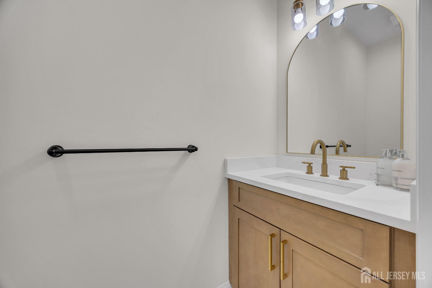 265 West Prescott Avenue Edison, NJ 08820 - Photo 25 of 56 a bathroom with a sink and a mirror