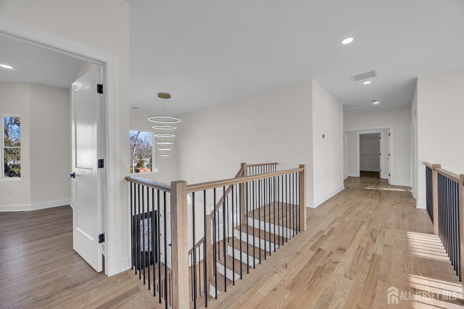 265 West Prescott Avenue Edison, NJ 08820 - Photo 28 of 56 a view of a hallway with wooden floor and stairs