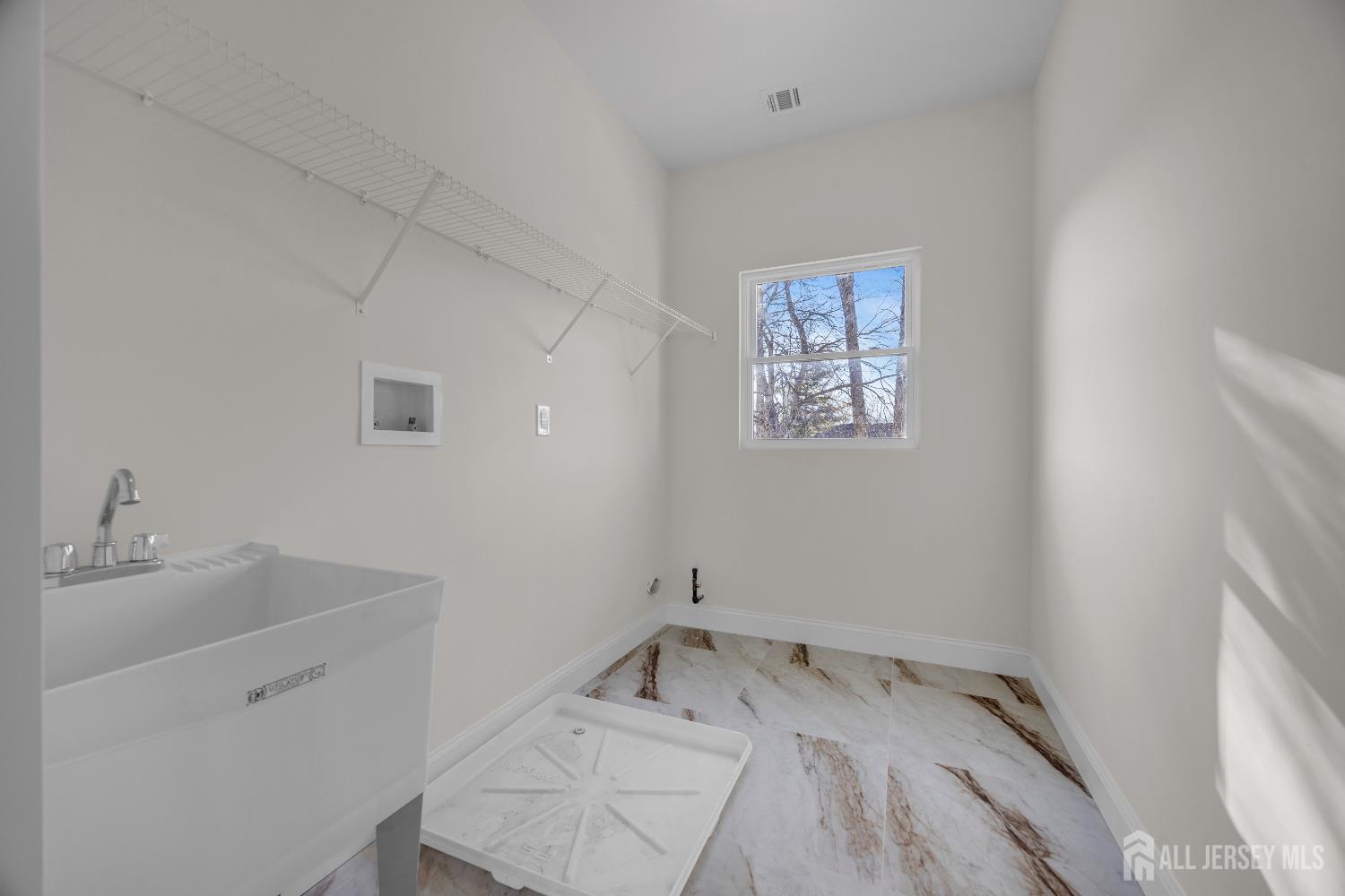 265 West Prescott Avenue Edison, NJ 08820 - Photo 35 of 56 a bathroom with a sink and a window