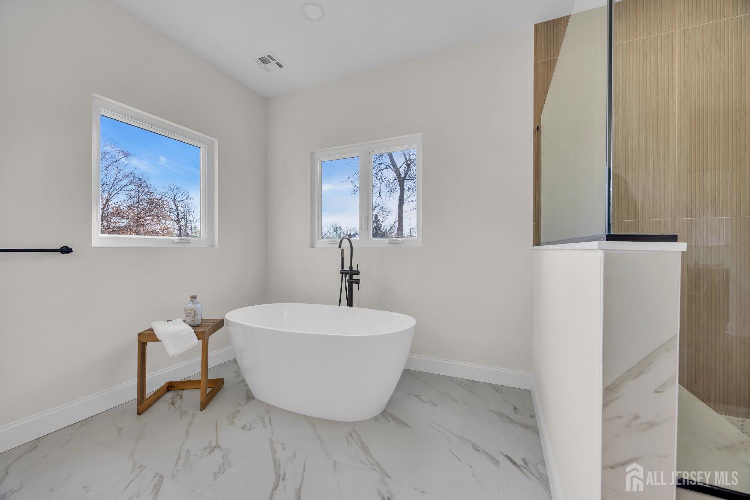 265 West Prescott Avenue Edison, NJ 08820 - Photo 40 of 56 a white bath tub sitting next to a white sink and a mirror