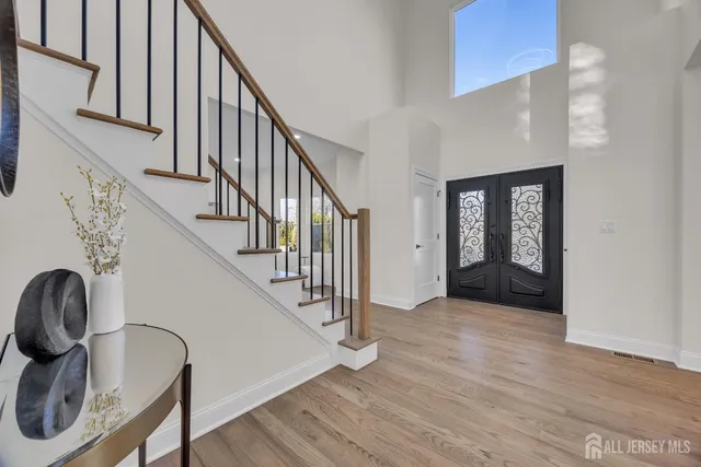 a view of a dining room with a table and chairs