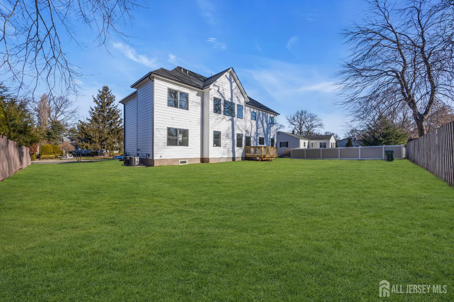 265 West Prescott Avenue Edison, NJ 08820 - Photo 55 of 56 a front view of a house with a yard