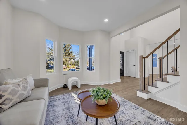 a large kitchen with kitchen island a sink a center island stainless steel appliances and a center island