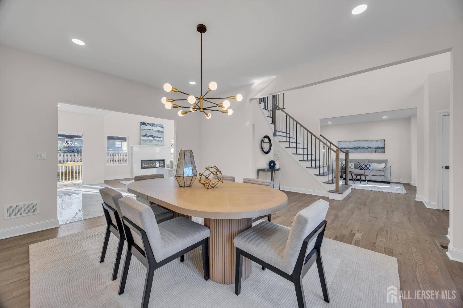 265 West Prescott Avenue Edison, NJ 08820 - Photo 10 of 56 a dining room with furniture a chandelier and wooden floor