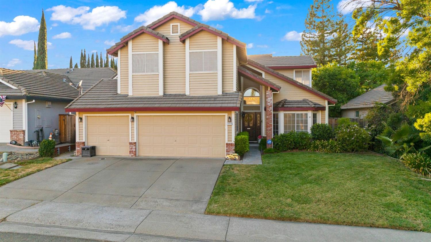8149 Chimango Court Antelope, CA 95843 - Photo 1 of 1 a front view of a house with a yard and garage