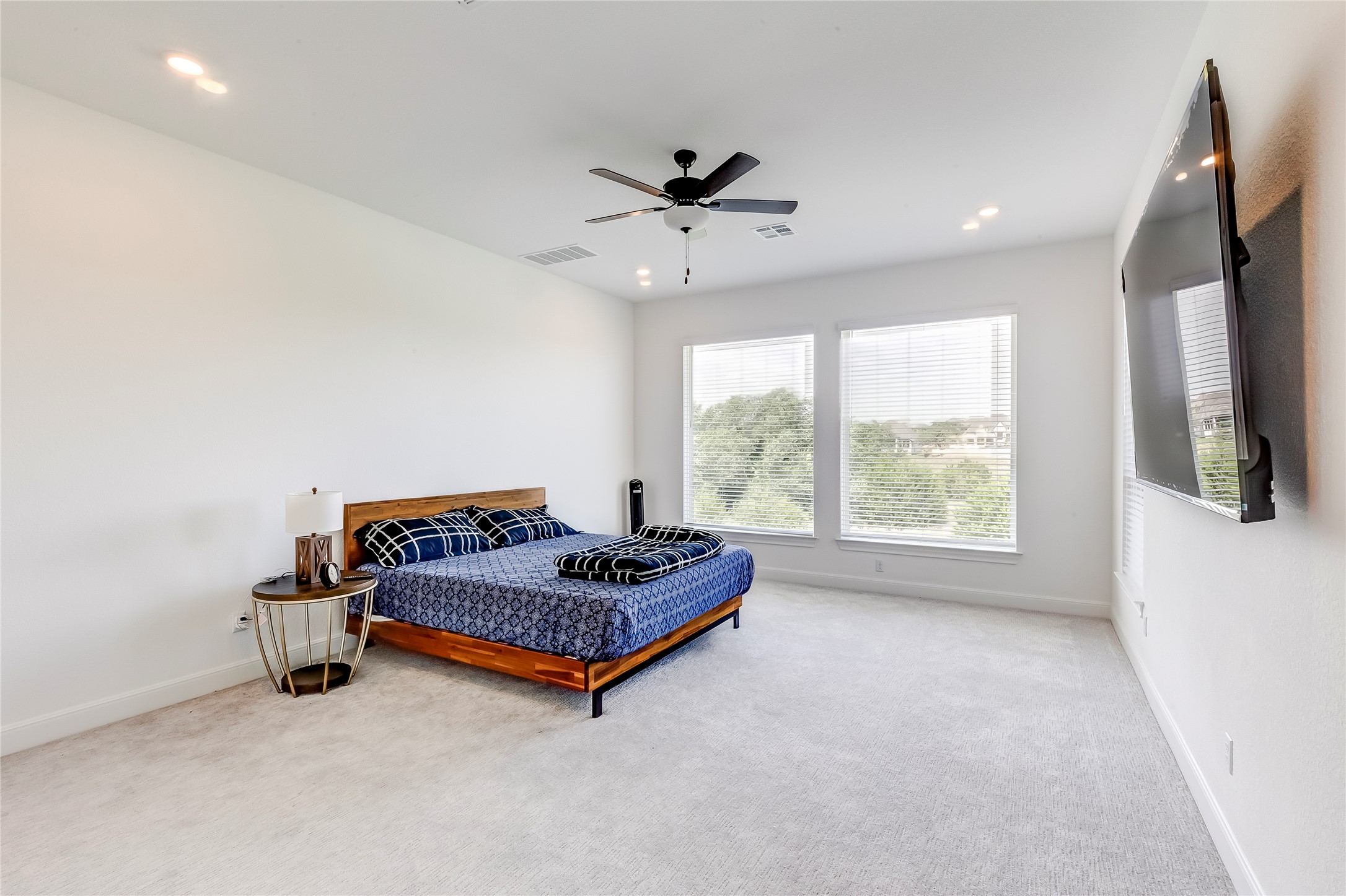 462 Old Stone Road Austin, TX 78737 - Photo 21 of 39 Bedroom featuring light carpet, ceiling fan, and recessed lighting